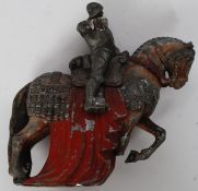 A mid 20th century cast metal match strike in the form of a Knight on Horseback