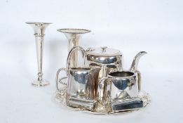 A good quality silver plate tea service comprising matching teapot,