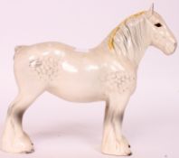 A Beswick ceramic figurine of a Shire Horse having white  / yellow braid H23cm