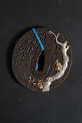 An antique style Japanese oriental bronze sword tsuba.