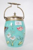 An early 20th century Turquoise blue glass biscuit barrel, enamelled with flowers and butterflies,