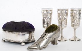 A mixed lot to include 3x white metal (stamped 925 indicating silver ) sherry glasses,