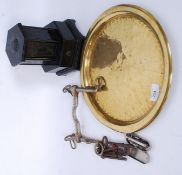A vintage brass tray and a collection of curios to include a chrome horse bit,