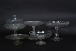 Glassware; A collection of glass cake stands to include cake dome, three tier stand,