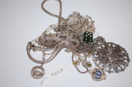 A  collection of 14 silver necklaces to include one with jade pendant in the shape of a dice,