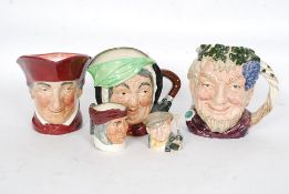 A collection of Royal Doulton Toby character jugs to include large Sairey Gamp ( green stamped