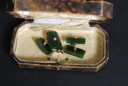 A pair of 9ct gold and jade / moss agate stone gentlemans cufflinks united by chain connections.