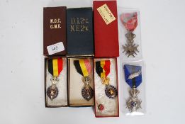 A collection of Flemish / Belgium morality medals to include a morals skill Medal army insignia