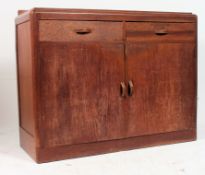 A 1930's Art Deco oak sideboard. Of shaped form sat on plinth base with cupboards and short drawers.