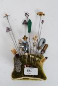 An excellent collection of Victorian and later gold and silver hatpins of differing designs and