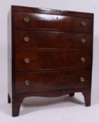 A 19th century flame mahogany caddy top chest of drawers.