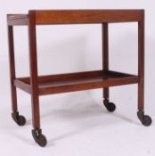 A 1960's Gordon Russell mahogany twin tier buffet / butlers trolley having sprung original castors