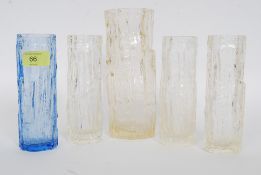 A collection of four clear glass bark vases in the manor of Whitefriars along with anther bark vase