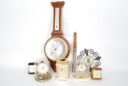 A collection of carriage clocks and barometers along with travel clocks