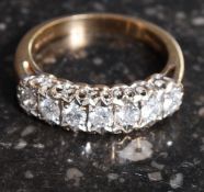 A 9ct gold and 7 stone diamond ladies ring.