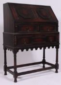 A good 1920's Jacobean revival oak bureau.