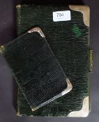A hallmarked silver writing folder, along with a similar silver hallmarked bordered wallet.