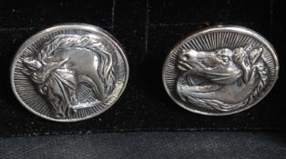 A pair of 925 white metal silver cufflinks depicting horses