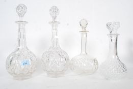 A collection of decanters to include cut glass to include a good matching pair,