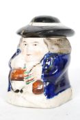 A 19th century stub toby jug with hat lid being unsigned ( af )