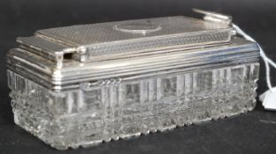 A silver and cut glass hallmarked dressing table pot having screw down hinged top.