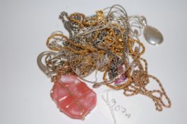 A collection of 9 silver, white and yellow metal ladies necklaces some with pendants,