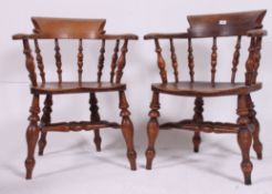 An excellent pair of Victorian beech and elm wood Smokers Bow Windsor armchairs.