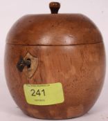 A wooden fruitwood tea caddy in the form of an apple having hinged top with key to centre