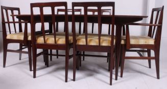 A 1970's retro afromosia teak large dining table and 6 chairs in the Danish style by Younger's.