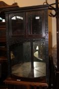 A Victorian Chinese Chippendale style ebonised mahogany corner cabinet.
