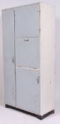 A vintage mid century painted kitchen cupboard having a tall larder section and three subsequent