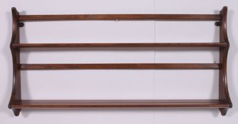 A vintage retro 1970's beech and elm wood plate rack in the Golden Dawn colour.