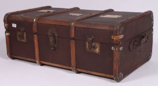 A good 20th century canvas and wooden strap steamer trunk suitcase with brass latches and hinged