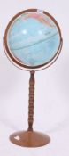 A vintage / retro floos standing Political Globe raised on a turned bobbin stand H80 W30 cm