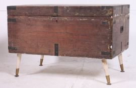 A 19th century steamer trunk with ebonised hinged brackets with hinged top H47 W69 D46cm