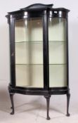 A 19th century Victorian ebonised mahogany serpentine fronted glass bookcase / display cabinet.