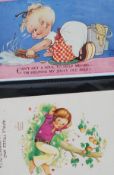 A vintage postcard album containing postcards by Lucie Mable Atwell, comic, silks,