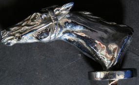 A 20th century chrome plated car mascot in the form of a racing horse ( see illustration )