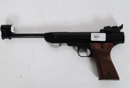 A vintage Italian made air pistol gun, with attached sight to end.