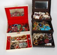 Two jewellery boxes both containing costume jewellery to include necklaces, bangles.