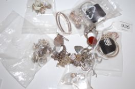 A Large selection of silver earrings some set with gemstones.