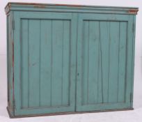 An early 20th century shabby chic painted pine school cupboard / cabinet.
