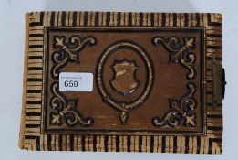 An early 20th century heavily tooled leather photograph album with card pages and photo recesses