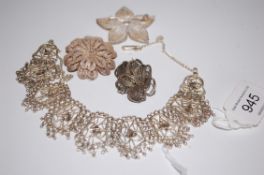 A collection of 3 vintage silver filigree brooches together with a filigree necklace.