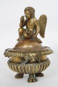 A 19th century bronze incense burner, depicting a seated cherub to the top,