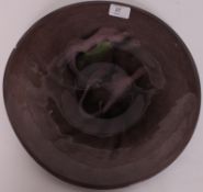 A decorative large 20th century Studio art glass charger of circular heavy form with irridescent