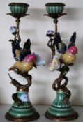 A pair of antique style ceramic candlesticks,