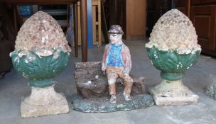 A pair of reconstituted stone pineapple gate post finials,