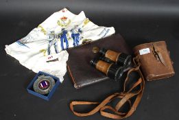 A mixed lot to include a vintage cast metal RAC car badge, cased binoculars, writing case,