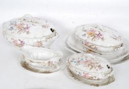 A 19th century Staffordshire part dinner service in a chintz pattern to include tureens,